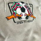 Tote bag with a colorful graphic of a soccer ball and text on a beige background